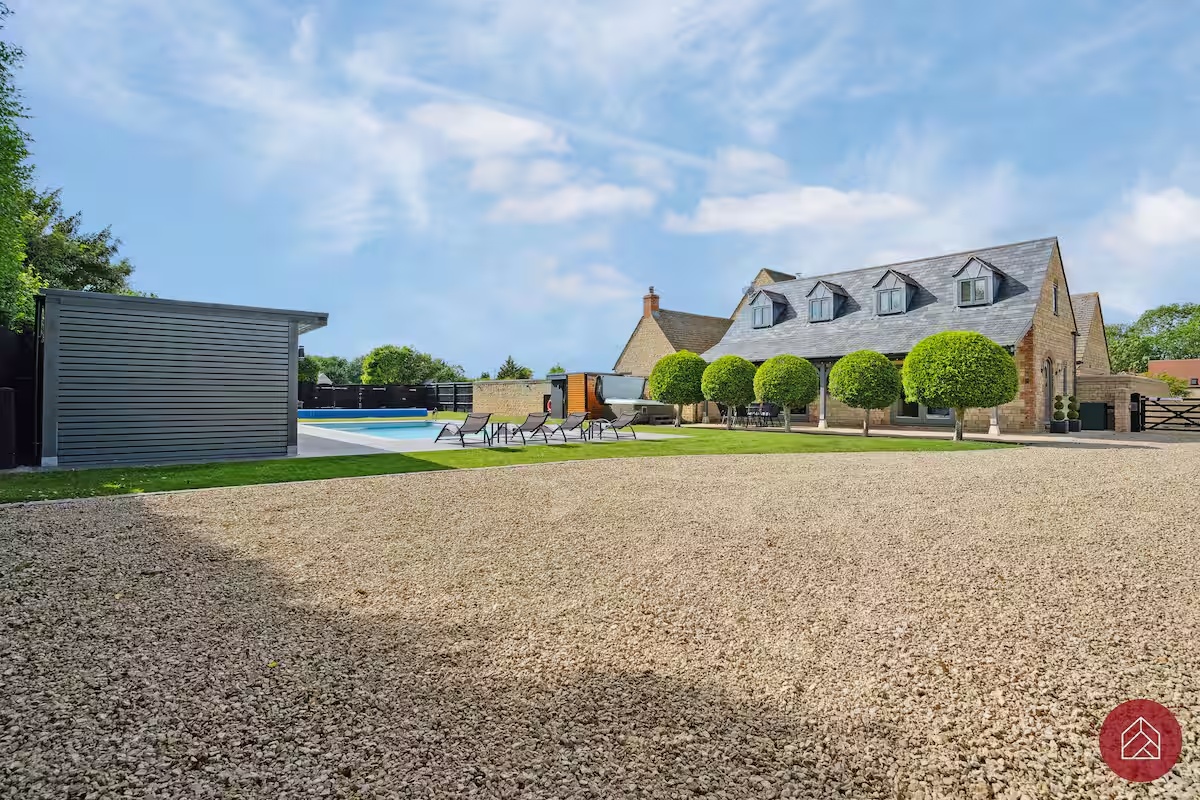 The stone exterior of Ingleby Retreat overlooking the garden